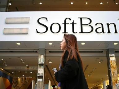 Japan’s SoftBank Group trims investment losses but remains in red for fiscal year