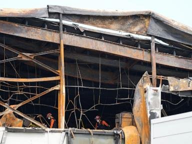 South Korean investigators search in factory ruins after fire killed 23, mostly Chinese migrants