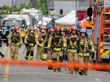 South Korean rescuers search burned factory after a blaze killed 22, mostly Chinese migrants